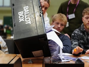 A ballot box being emptied