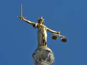 The Lady Justice statue atop the Central Criminal Court, also referred to as the Old Bailey, London