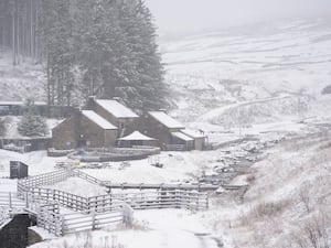 Properties in the countryside covered by snow