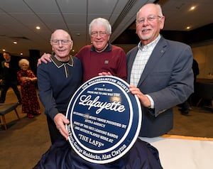 George Maddocks, Tony Perry and Alan Clayton proudly pose with the blue plaque