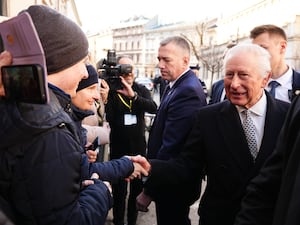 The King talks to members of the public during his visit the Jewish Community Centre Krakow