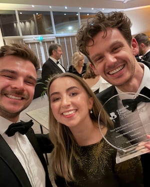 Oliver, Emily, and Lewis from Techcare with their award.