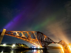 The aurora borealis, also known as the Northern Lights, above the Forth Bridge at North Queensferry in May