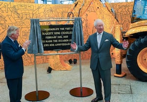 King Charles III unveils a plaque with Lord Bamford (left) during a visit to JCB World headquarters in Rocester. Photo: Arthur Edwards/The Sun/PA Wire