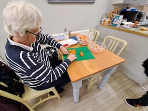 Val Archer preparing her vegetables