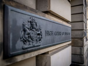 View of a sign reading High Court of Justice