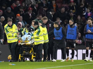 Lukasz Fabianski leaves the pitch on a stretcher