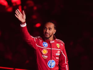 Lewis Hamilton waves to the crowd during the F1 75 Live launch event at The O2