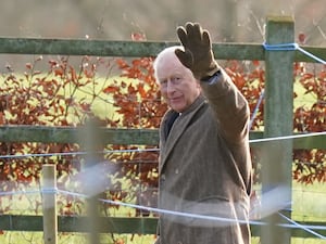 Charles waves to well-wishers as he leaves a church service at St Mary Magdalene Church in Sandringham on Sunday