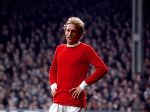 Denis Law with hands on hips