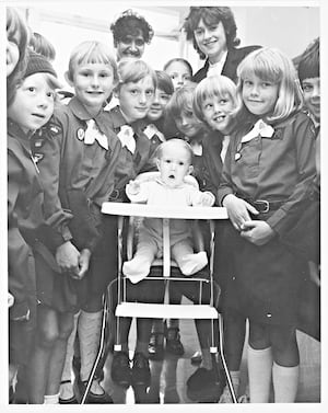 Members of the 3rd Penn Brownies saved halpennies to raise money for a new high chair for a hospital. Nurses Barbara Lathe and Brenda Taylor of Swancote Drive, Penn are mentioned.