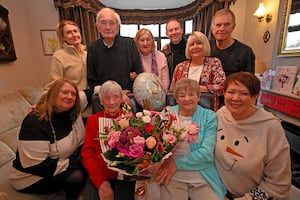 Margaret and Dot pose with their daughters, left, Suzanne Johnson and Mandy Jordan and other members of the family