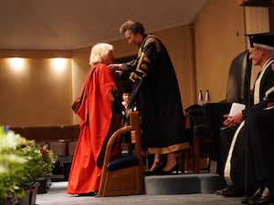 The Queen being presented with her honorary doctorate