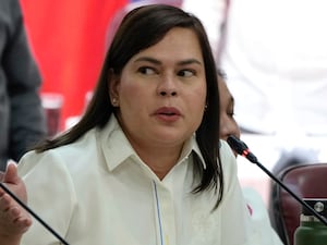 Sara Duterte gestures as she attends a hearing at the House of Representative in Quezon City