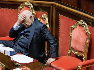 Italian justice minister Carlo Nordio puts his hand to his head during the presentation of the report on the justice administration at the Senate in Rome