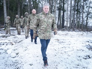 Sir Keir Starmer in camouflage visiting a Nato base in Estonia near its border with Russia