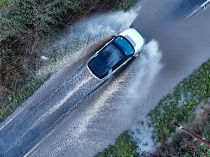 A car drives through flooding in Worcestershire