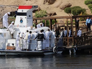 People carry the coffin of Prince Karim Al-Hussaini, the Aga Khan IV and 49th hereditary imam of the Shiite Ismaili Muslims, to be buried at the Aga Khan mausoleum in Aswan, Egypt