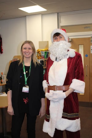 Miss Clare Turner (Assistant Head) with Father Christmas, Stephen Hill (Year 13 student)