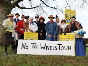 People dressed as Camberwick Green characters mounting a protest