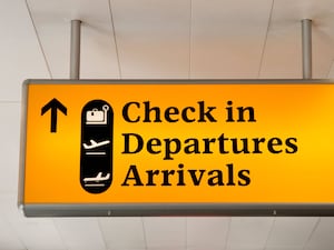 A check-in airport sign