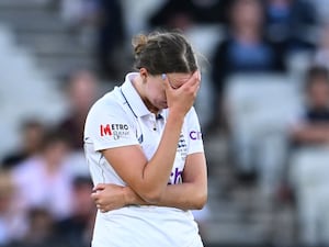 Bowler Lauren Filer holds her head as England slid to a Women's Ashes whitewash