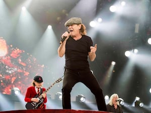 Brian Johnson singing on stage at Hampden Park