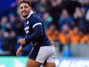 Scotland’s Sione Tuipulotu celebrates scoring a try against Australia