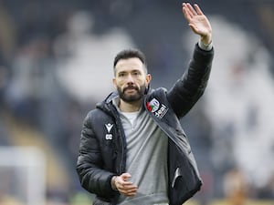 West Brom manager Carlos Corberan waves to fans after beating Hull