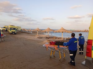 Rescuers wait on the beach of Marsa Alam, in Egypt