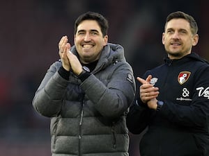 Andoni Iraola, left, claps the Bournemouth fans