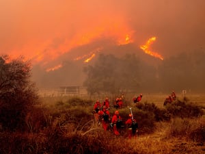 Firefighters battle wildfires in Los Angeles