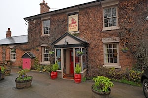 The distinctive frontage of the pub draws you in