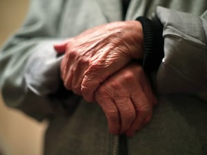 The hands of an elderly woman.