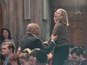 A heckler is removed as Wes Streeting speaks