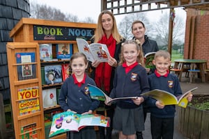 (Left) Freya Halsall and (Right) Lisa Gosling from Vistry North Central Midlands with three Franche Primary School students, holding just some of the books from their new book nook