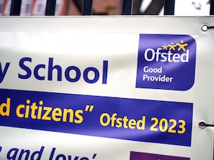 An Ofsted banner outside a school