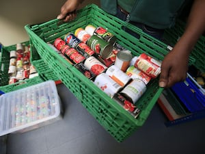 Tins of tomatoes in a crate