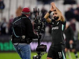 Mohamed Salah applauds fans after the final whistle