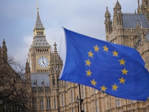 An EU flag flying in front of Westminster