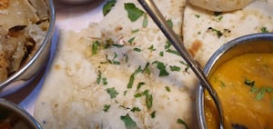 Fluffy and well seasoned, the naan bread is a worthy part of the meal