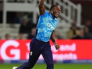 Jofra Archer celebrates taking a wicket