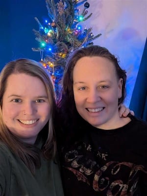 Jodie (right) with wife Holly (left) are celebrating their first Christmas as foster parents