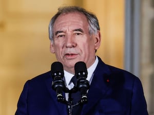 A close-up of Prime Minister Francois Bayrou speaking