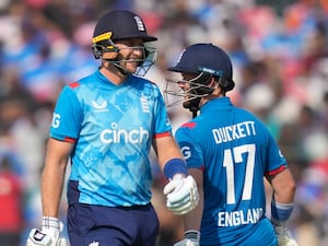 England’s Ben Duckett, right, and Joe Root shares a light moment