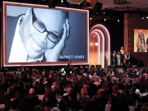 Martina Jones, from left, Rashida Jones, and Quincy Jones III accept a posthumous honorary award for Quincy Jones during the 15th Governors Awards at the Ray Dolby Ballroom in Los Angeles