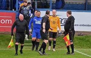 Raymond and Jordan Mitchell lead the teams out.