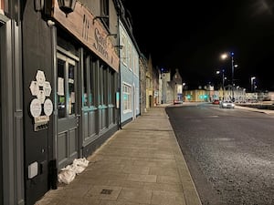 Sandbags in shop doorways in a street in Donaghadee