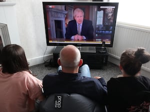 People in a house in Liverpool watch Prime Minister Boris Johnson address the nation about coronavirus on May 10 2020