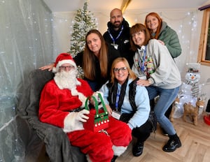 Father Christmas and the team who have helped to put the grotto together